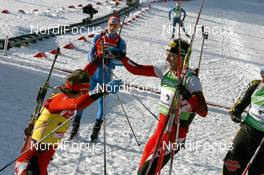 21.03.2010, Holmenkollen, Norway (NOR): Emil Hegle Svendsen (NOR), Madshus, Rottefella, Swix, Odlo and Christoph Sumann (AUT), Atomic, Leki  - IBU world cup biathlon, mass men, Holmenkollen (NOR). www.nordicfocus.com. © Manzoni/NordicFocus. Every downloaded picture is fee-liable.