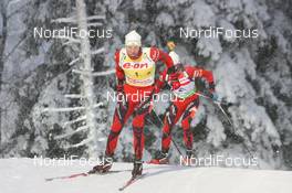 05.12.2010, Oestersund, Sweden (SWE): Emil Hegle Svendsen (NOR), Madshus, Rottefella, Swix, Odlo leads Ole Einar Bjoerndalen (NOR), Madshus, Rottefella, Odlo - IBU world cup biathlon, pursuit men, Oestersund (SWE). www.nordicfocus.com. © Manzoni/NordicFocus. Every downloaded picture is fee-liable.