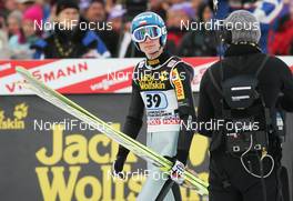 01.01.2010, Garmisch, Germany (GER): Kamit Stoch (POL) - FIS world cup ski jumping, four hills tournament, individual HS140, Garmisch (GER). www.nordicfocus.com. © Domanski/NordicFocus. Every downloaded picture is fee-liable.