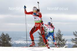 17.03.2011, Holmenkollen, Norway (NOR): Ann Kristin Aafedt Flatland (NOR), Madshus, Rottefella, Alpina, Swix, ODLO, Svetlana Sleptsova (RUS), Fischer, Rottefella, Alpina, Swix, adidas - IBU world cup biathlon, sprint women, Holmenkollen (NOR). www.nordicfocus.com. © Manzoni/NordicFocus. Every downloaded picture is fee-liable.