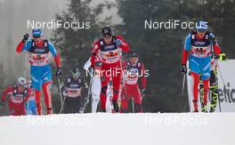 20.11.2011, Sjusjoen, Norway (NOR): (l-r) Evgeniy Belov (RUS), Fischer, Swix, Alpina, Rottefella, Adidas, Eldar Roenning (NOR), Rossignol, Swix, Rottefella and Dmitriy Japarov (RUS), Fischer, Swix, Alpina, Rottefella, Adidas  - FIS world cup cross country, 4x10km men, Sjusjoen (NOR). www.nordicfocus.com. Â© Laiho/NordicFocus. Every downloaded picture is fee-liable.