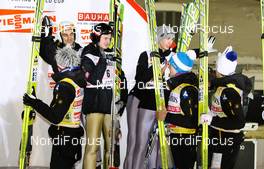 12.03.2011, Lahti, Finland (FIN): team Poland clapping hands with the winners, team Austria  - FIS world cup ski jumping, team HS130, Lahti (FIN). www.nordicfocus.com. © Laiho/NordicFocus. Every downloaded picture is fee-liable.