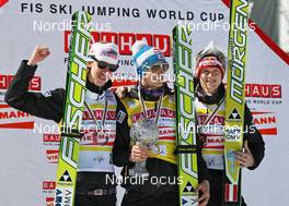20.03.2011, Planica, Slovenia (SLO): Ski Flying Overall World Cup Podium: l-r: Martin Koch (AUT), Fischer, Gregor Schlierenzauer (AUT), Fischer, Thomas Morgenstern (AUT), Fischer  - FIS world cup ski jumping final, cups, Planica (SLO). www.nordicfocus.com. © Hemmersbach/NordicFocus. Every downloaded picture is fee-liable.
