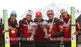 20.03.2011, Planica, Slovenia (SLO): Autrian Ski Jumping Team, Oslo Medal Winners with Head Coach, l-r: Gregor Schlierenzauer (AUT), Fischer, Andreas Kofler (AUT), Fischer, Alexander Pointner (AUT), Head Coach Team Austria, Thomas Morgenstern (AUT), Fischer, Martin Koch (AUT), Fischer  - FIS world cup ski jumping final, cups, Planica (SLO). www.nordicfocus.com. © Hemmersbach/NordicFocus. Every downloaded picture is fee-liable.