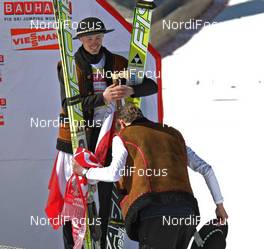 20.03.2011, Planica, Slovenia (SLO): todays winner Kamil Stoch (POL), Fischer take a bow in front of Adam Malysz (POL), Fischer, who finishes his carreer - FIS world cup ski jumping final, individual HS215, Planica (SLO). www.nordicfocus.com. © Hemmersbach/NordicFocus. Every downloaded picture is fee-liable.