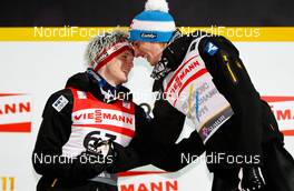 03.03.2011, Oslo, Norway (NOR):  (l-r) Thomas Morgenstern (AUT), Fischer congratulates the winner Gregor Schlierenzauer (AUT), Fischer - FIS nordic world ski championships, ski jumping, individual HS134, Oslo (NOR). www.nordicfocus.com. © Laiho/NordicFocus. Every downloaded picture is fee-liable.