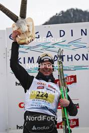 13.03.2011, St. Moritz, Switzerland (SUI): todays winner Remo Fischer (SUI), Fischer, Rottefella, Alpina, KV+, Odlo with the engadiner trophy - FIS Marathon Cup Engadin Skimarathon, St. Moritz (SUI). www.nordicfocus.com. © Hemmersbach/NordicFocus. Every downloaded picture is fee-liable.
