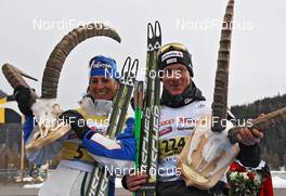 13.03.2011, St. Moritz, Switzerland (SUI): todays winner, l-r: Antonella Confortola (ITA), Fischer, Salomon, Star, Rudy Project and Remo Fischer (SUI), Fischer, Rottefella, Alpina, KV+, Odlo - FIS Marathon Cup Engadin Skimarathon, St. Moritz (SUI). www.nordicfocus.com. © Hemmersbach/NordicFocus. Every downloaded picture is fee-liable.