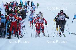 07.01.2012, Val di Fiemme, Italy (ITA): l-r: Justyna Kowalczyk (POL), Fischer, Rottefella, Swix Therese Johaug (NOR), Fischer, Salomon, Swix, Kikkan Randall (USA), Fischer, Salomon, Swix  - FIS world cup cross-country, tour de ski, mass women, Val di Fiemme (ITA). www.nordicfocus.com. © Hemmersbach/NordicFocus. Every downloaded picture is fee-liable.