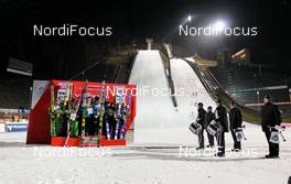 23.11.2012, Lillehammer, Norway (NOR):  Teams on the podium (l-r) Japan (JPN), Norway (NOR) and Italy (ITA) - FIS world cup ski jumping, mixed team HS100, Lillehammer (NOR). www.nordicfocus.com. © Laiho/NordicFocus. Every downloaded picture is fee-liable.