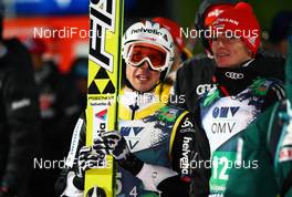 23.11.2012, Lillehammer, Norway (NOR):  (l-r) Simon Ammann (SUI), Fischer and Richard Freitag (GER), Fischer - FIS world cup ski jumping, mixed team HS100, Lillehammer (NOR). www.nordicfocus.com. © Laiho/NordicFocus. Every downloaded picture is fee-liable.