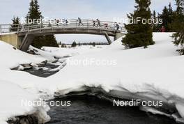 17.03.2012, Rena, Norway (NOR): Skiers going over the bridge near Sjusjoen - FIS Marathon Cup Birkebeinerrennet, Rena (NOR). www.nordicfocus.com.© Veltheim/NordicFocus. Every downloaded picture is fee-liable