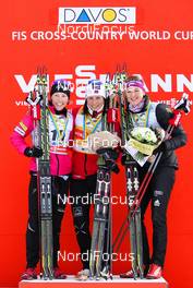 15.12.2013, Davos, Switzerland (SUI): (l-r) Kikkan Randall (USA), Fischer, Swix, Salomon, Marit Bjoergen (NOR), Fischer, Swix, Rottefella and Denise Hermann (GER), Fischer, Swix, Apina, Rottefella, Adidas - FIS world cup cross-country, individual sprint, Davos (SUI). www.nordicfocus.com. © Laiho/NordicFocus. Every downloaded picture is fee-liable.