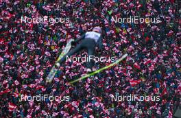 04.01.2013, Innsbruck, Austria (AUT): lots of austrian flags while Andreas Kofler (AUT), Fischer jumps  - FIS world cup ski jumping, four hills tournament, individual HS130, Innsbruck (AUT). www.nordicfocus.com. © Laiho/NordicFocus. Every downloaded picture is fee-liable.
