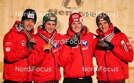 02.03.2013, Val di Fiemme, Italy (ITA): (l-r) Wolfgang Loitzl (AUT), Fluege.de, Manuel Fettner (AUT), Fluege.de, Thomas Morgenstern (AUT), Fischer and Gregor Schlierenzauer (AUT), Fischer - FIS nordic world ski championships, ski jumping, team HS134, Val di Fiemme (ITA). www.nordicfocus.com. © Laiho/NordicFocus. Every downloaded picture is fee-liable.