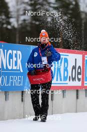 13.03.2014, Kontiolahti, Finland (FIN): volunteers throwing salt onto the track, 25kg for every 100 meters - IBU world cup biathlon, sprint men, Kontiolahti (FIN). www.nordicfocus.com. © Laiho/NordicFocus. Every downloaded picture is fee-liable.