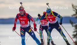 13.03.2014, Kontiolahti, Finland (FIN): (l-r) Dmitry Malyshko (RUS), Fischer, Rottefella, Alpina, Leki, adidas and Bjoern Ferry (SWE), Fischer, Rottefella, Leki, adidas - IBU world cup biathlon, sprint men, Kontiolahti (FIN). www.nordicfocus.com. © Laiho/NordicFocus. Every downloaded picture is fee-liable.