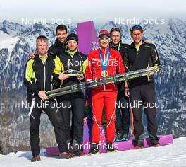 10.02.2014, Sochi, Russia (RUS): Dario Cologna (SUI) and the Fischer service team - XXII. Olympic Winter Games Sochi 2014, cross-country, medals, Sochi (RUS). www.nordicfocus.com. © NordicFocus. Every downloaded picture is fee-liable.