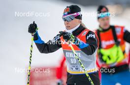 21.12.2014, Davos, Switzerland (SUI): salomon feature, Riikka Sarasoja-Lilja (FIN) testing her skis before the sprint race - FIS world cup cross-country, individual sprint, Davos (SUI). www.nordicfocus.com. © Laiho/NordicFocus. Every downloaded picture is fee-liable.