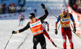 14.03.2015, Oslo, Norway (NOR): (l-r) Dario Cologna (SUI), Fischer, One Way, Rottefella, Odlo and Martin Jonsrud Sundby (NOR), Fischer, KV+, Rottefella - FIS world cup cross-country, mass men, Oslo (NOR). www.nordicfocus.com. © Laiho/NordicFocus. Every downloaded picture is fee-liable.