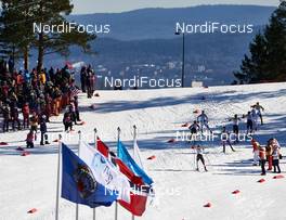14.03.2015, Oslo, Norway (NOR): the chasing group passes the stadium - FIS world cup nordic combined, individual gundersen HS134/10km, Oslo (NOR). www.nordicfocus.com. © Felgenhauer/NordicFocus. Every downloaded picture is fee-liable.