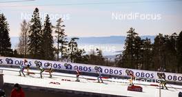 14.03.2015, Oslo, Norway (NOR): a group of skiers passing the stadium - FIS world cup nordic combined, individual gundersen HS134/10km, Oslo (NOR). www.nordicfocus.com. © Laiho/NordicFocus. Every downloaded picture is fee-liable.