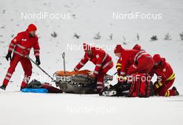 06.01.2015, Bischofshofen, Austria (AUT): Simon Ammann (SUI) helped by the rescue team - FIS world cup ski jumping, four hills tournament, individual HS140, Bischofshofen (AUT). www.nordicfocus.com. © Laiho/NordicFocus. Every downloaded picture is fee-liable.