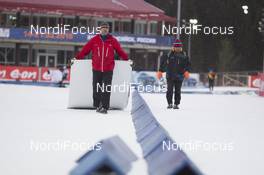 16.03.2016, Khanty-Mansiysk, Russia (RUS): Event Feature: Infront guys carry billboards through the stadium -  IBU world cup biathlon, training, Khanty-Mansiysk (RUS). www.nordicfocus.com. © Manzoni/NordicFocus. Every downloaded picture is fee-liable.