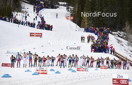 12.03.2016, Canmore, Canada (CAN): a chasing group passes the stadium   - FIS world cup cross-country, pursuit men, Canmore (CAN). www.nordicfocus.com. © Felgenhauer/NordicFocus. Every downloaded picture is fee-liable.