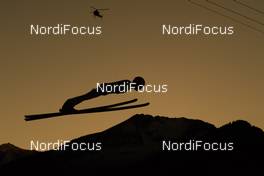 30.12.2016, Oberstdorf, Germany (GER): ski jumper at sunset with helicopter - FIS world cup ski jumping, four hills tournament, individual HS137, Oberstdorf (GER). www.nordicfocus.com. © Rauschendorfer/NordicFocus. Every downloaded picture is fee-liable.