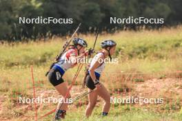 26.08.2023, Brezno-Osrblie, Slovakia (SVK): Lenka Bartova (CZE), Emilia Sainciuc (MDA), (l-r) - IBU Summer Biathlon World Championships, sprint junior women, Brezno-Osrblie (SVK). www.nordicfocus.com. © Manzoni/NordicFocus. Every downloaded picture is fee-liable.