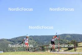 24.08.2023, Brezno-Osrblie, Slovakia (SVK): Martin Hollo (HUN), Abdulkerim Hodzic (SRB), (l-r) - IBU Summer Biathlon World Championships, super sprint junior men, Brezno-Osrblie (SVK). www.nordicfocus.com. © Manzoni/NordicFocus. Every downloaded picture is fee-liable.