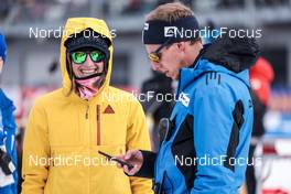 16.02.2023, Oberhof, Germany (GER): Clare Egan (USA), Daniel Boehm (GER), IBU Sports Director, (l-r) - IBU World Championships Biathlon, single mixed relay, Oberhof (GER). www.nordicfocus.com. © Manzoni/NordicFocus. Every downloaded picture is fee-liable.