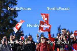 17.12.2023, Lenzerheide, Switzerland (SUI): Event Feature: Swiss fans with flags - IBU World Cup Biathlon, mass women, Lenzerheide (SUI). www.nordicfocus.com. © Manzoni/NordicFocus. Every downloaded picture is fee-liable.