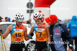 26.08.2023, Oberwiesenthal, Germany (GER): Magdalena Burger (GER), Maria Gerboth (GER), Physio Holger Meichsner, (l-r)  - FIS Nordic Combined Summer Grand Prix men and women, individual gundersen HS105/5km women, Oberwiesenthal (GER). www.nordicfocus.com. © Volk/NordicFocus. Every downloaded picture is fee-liable.