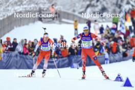 11.01.2024, Ruhpolding, Germany (GER): Christian Gow (CAN), Simon Eder (AUT), (l-r) - IBU World Cup Biathlon, relay men, Ruhpolding (GER). www.nordicfocus.com. © Manzoni/NordicFocus. Every downloaded picture is fee-liable.