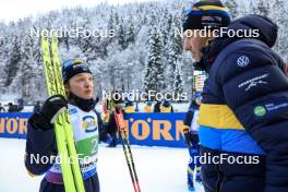 10.01.2024, Ruhpolding, Germany (GER): Linn Persson (SWE), Jean-Marc Chabloz (SUI), coach Team Sweden, (l-r) - IBU World Cup Biathlon, relay women, Ruhpolding (GER). www.nordicfocus.com. © Manzoni/NordicFocus. Every downloaded picture is fee-liable.