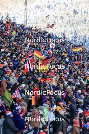 10.01.2024, Ruhpolding, Germany (GER): Event Feature: Fans cheering on the grandstand with flags - IBU World Cup Biathlon, relay women, Ruhpolding (GER). www.nordicfocus.com. © Manzoni/NordicFocus. Every downloaded picture is fee-liable.