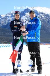 17.03.2024, Canmore, Canada (CAN): Lisa Vittozzi (ITA), Olle Dahlin (SWE), IBU President, (l-r) - IBU World Cup Biathlon, trophies, Canmore (CAN). www.nordicfocus.com. © Manzoni/NordicFocus. Every downloaded picture is fee-liable.