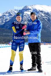17.03.2024, Canmore, Canada (CAN): Elvira Oeberg (SWE), Olle Dahlin (SWE), IBU President, (l-r) - IBU World Cup Biathlon, cups, Canmore (CAN). www.nordicfocus.com. © Manzoni/NordicFocus. Every downloaded picture is fee-liable.