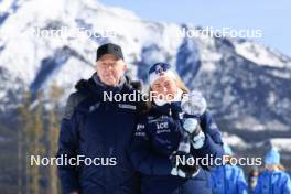 14.03.2024, Canmore, Canada (CAN): Olle Dahlin (SWE), IBU President, Ingrid Landmark Tandrevold (NOR), (l-r) - IBU World Cup Biathlon, trophies, Canmore (CAN). www.nordicfocus.com. © Manzoni/NordicFocus. Every downloaded picture is fee-liable.