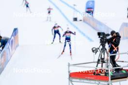 13.03.2024, Canmore, Canada (CAN): Event Feature: Installing a TV camera while undifined athletes compete - IBU World Cup Biathlon, training, Canmore (CAN). www.nordicfocus.com. © Manzoni/NordicFocus. Every downloaded picture is fee-liable.