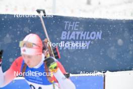 24.01.2024, Brezno-Osrblie, Slovakia (SVK): Undefined athlete competes in front of the Biathlon Family banner - IBU Open European Championships Biathlon, individual men, Brezno-Osrblie (SVK). www.nordicfocus.com. © Reichert/NordicFocus. Every downloaded picture is fee-liable.