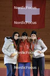 23.03.2024, Oberwald, Switzerland (SUI): Chiara Arnet (SUI), Ronja Rietveld (SUI), Lara Berwert (SUI), (l-r) - Swiss Championships biathlon, prize giving ceremony, Oberwald (SUI). www.nordicfocus.com. © Manzoni/NordicFocus. Every downloaded picture is fee-liable.