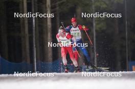 07.02.2024, Nove Mesto na Morave, Czechia (CZE): Christian Gow (CAN), Damian Cesnek (SVK), (l-r) - IBU World Championships Biathlon, mixed relay, Nove Mesto na Morave (CZE). www.nordicfocus.com. © Thibaut/NordicFocus. Every downloaded picture is fee-liable.