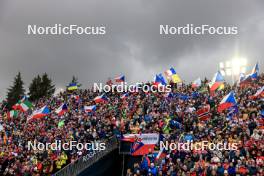 17.02.2024, Nove Mesto na Morave, Czechia (CZE): Event Feature: Fans with flags on the grandstand - IBU World Championships Biathlon, relay women, Nove Mesto na Morave (CZE). www.nordicfocus.com. © Manzoni/NordicFocus. Every downloaded picture is fee-liable.