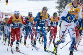 06.01.2024, Val di Fiemme, Italy (ITA): Haavard Solaas Taugboel (NOR), Remi Lindholm (FIN), (l-r)  - FIS world cup cross-country, tour de ski, mass, Val di Fiemme (ITA). www.nordicfocus.com. © Modica/NordicFocus. Every downloaded picture is fee-liable.