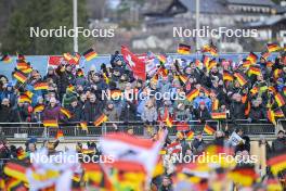 01.01.2024, Garmisch, Germany (GER): German spectators with their flag - FIS world cup ski jumping men, four hills tournament, individual HS142, Garmisch (GER). www.nordicfocus.com. © Reichert/NordicFocus. Every downloaded picture is fee-liable.