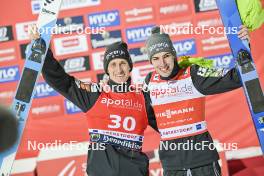 24.02.2024, Oberstdorf, Germany (GER): Peter Prevc (SLO), Timi Zajc (SLO), (l-r) - FIS world cup ski jumping men, individual HS235, Oberstdorf (GER). www.nordicfocus.com. © Reichert/NordicFocus. Every downloaded picture is fee-liable