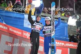 23.02.2024, Oberstdorf, Germany (GER): Timi Zajc (SLO), Domen Prevc (SLO), (l-r)  - FIS world cup ski jumping men, super team HS235, Oberstdorf (GER). www.nordicfocus.com. © Reichert/NordicFocus. Every downloaded picture is fee-liable